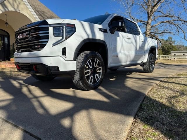 2025 GMC Sierra 1500 AT4 in Summit White — front three-quarter view